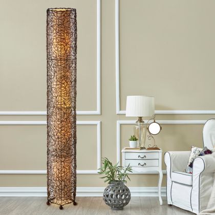 In a sun drenched entryway, crafted by the artisans of Eangee Home Design, the Nito Giant Floor Lamp in natural stands gracefully, featuring recycled paper shade, eco friendly, sustainably sourced, recycled materials, adding warmth and character to the space.