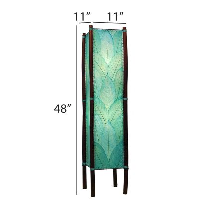 The Fortune Large Floor crafted by the artisans of Eangee Home Design Lamp in sea blue finish by Eangee Home Design displayed against a white background highlights its fossilized cocoa leaf panels, abaca twine accents, rattan legs, wrought iron frame, hand placed natural leaves, and abaca twine stitching, designed to there's something both grounded and graceful about the fortune floor lamp.