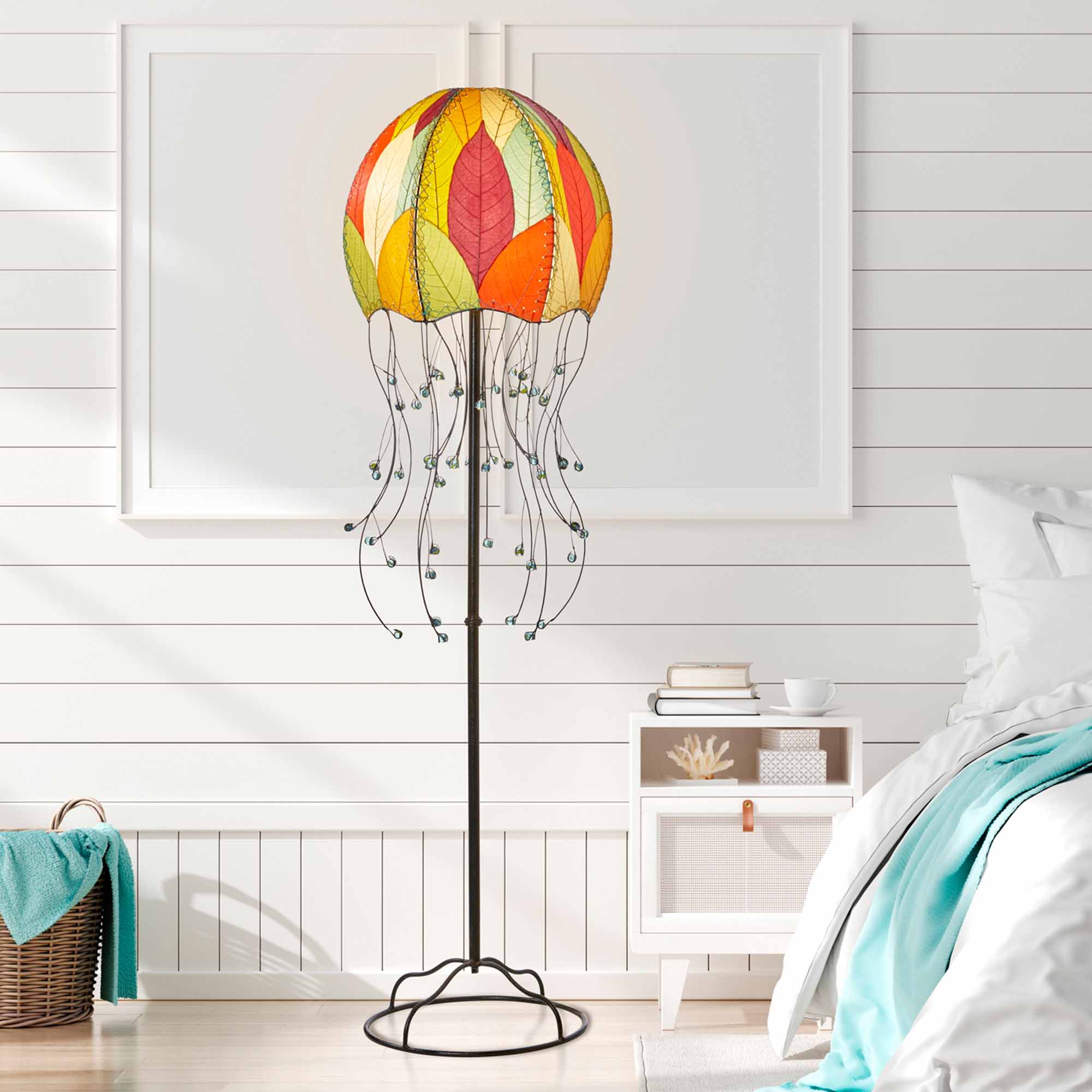 Crafted by the artisans of Eangee Home Design, the Jellyfish Large Floor Lamp in multi color against a clean backdrop, featuring fossilized cocoa leaf shade, wrought iron frame, eco friendly.
