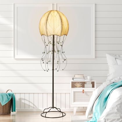 Crafted by the artisans of Eangee Home Design, the Jellyfish Large Floor Lamp in natural against a clean backdrop, featuring fossilized cocoa leaf shade, wrought iron frame, eco friendly.