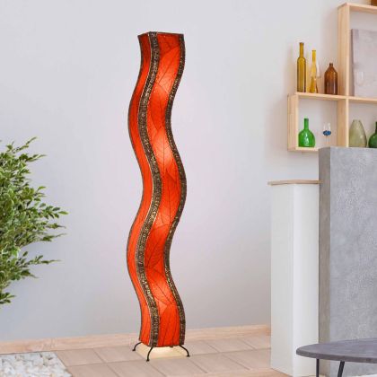 Crafted by the artisans of Eangee Home Design, the Wave Giant Floor Lamp in red against a clean backdrop, featuring fossilized cocoa leaf shade, abaca rope accents, eco friendly, handcrafted.