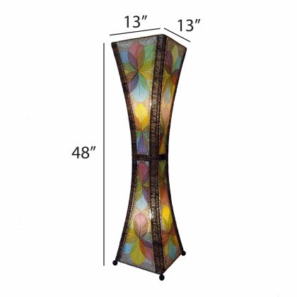 In a minimalist den with wooden accents, the Hourglass Large Floor crafted by the artisans of Eangee Home Design Lamp in multi color finish by Eangee Home Design stands tall, its jackfruit leaf panels, abaca twine accents, and hand placed natural leaves casting a warm glow that the hourglass large floor lamp is a quiet invitation to slow down.