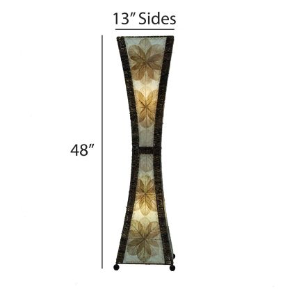 In a minimalist den with wooden accents, the Hourglass Large Floor crafted by the artisans of Eangee Home Design Lamp in natural finish by Eangee Home Design stands tall, its jackfruit leaf panels, abaca twine accents, and hand placed natural leaves casting a warm glow that the hourglass large floor lamp is a quiet invitation to slow down.