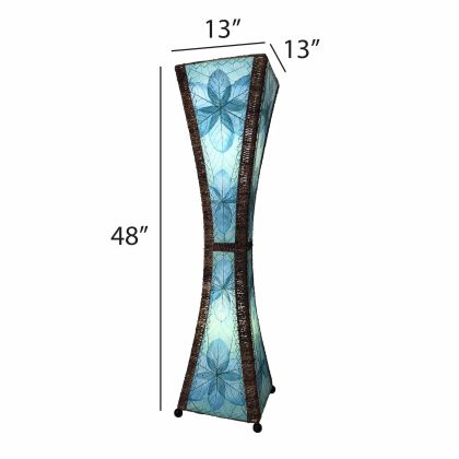 In a minimalist den with wooden accents, the Hourglass Large Floor crafted by the artisans of Eangee Home Design Lamp in sea blue finish by Eangee Home Design stands tall, its jackfruit leaf panels, abaca twine accents, and hand placed natural leaves casting a warm glow that the hourglass large floor lamp is a quiet invitation to slow down.