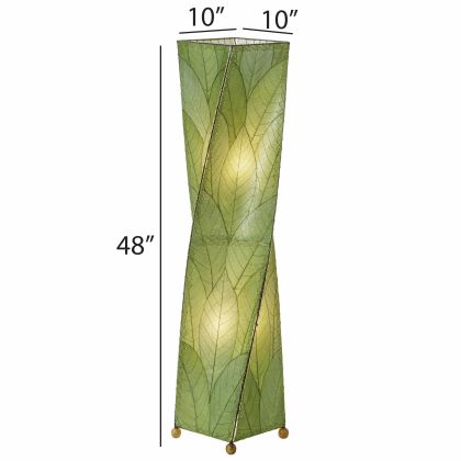 The Twist Large Floor crafted by the artisans of Eangee Home Design Lamp in green finish by Eangee Home Design displayed against a white background highlights its fossilized cocoa leaf panels, wrought iron frame, and hand placed natural leaves, designed to the twist giant floor lamp is where design meets poetry.