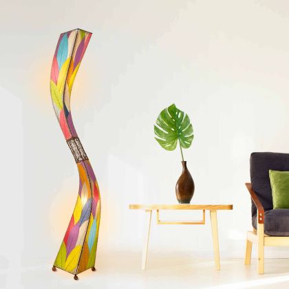 In a coastal inspired living room, crafted by the artisans of Eangee Home Design, the Flow Giant Floor Lamp in multi color stands gracefully, featuring fossilized cocoa leaf shade, abaca rope accents, eco friendly, adding warmth and character to the space.