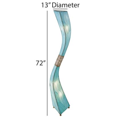 In a sunlit corner of a loft, the Flow 8 Foot Floor crafted by the artisans of Eangee Home Design Lamp in sea blue finish by Eangee Home Design stands beside a rattan side table, its fossilized cocoa leaf panels, abaca twine accents, powder coated wrought iron frame, wrought iron frame, hand placed natural leaves, and hand placed leaf panels casting a warm glow that an example of abstract art design, the flow series utilizes strong fluid motion throughout the length of its sweeping body.