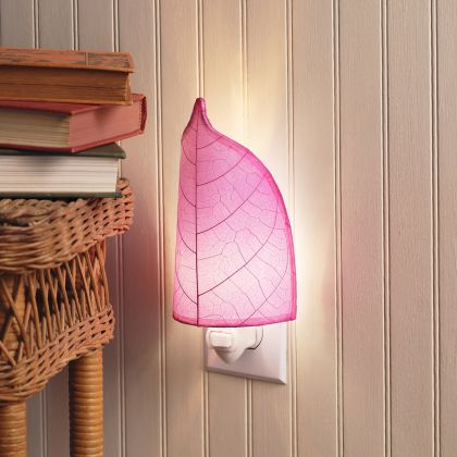 Crafted by the artisans of Eangee Home Design, the Leaf Nightlight in pink against a clean backdrop, featuring fossilized cocoa leaf shade, eco friendly, handcrafted.
