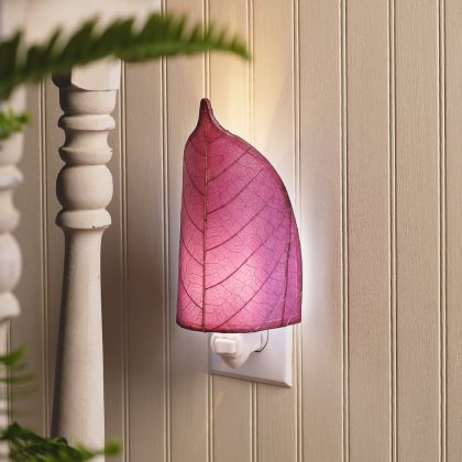 Crafted by the artisans of Eangee Home Design, the Leaf Nightlight in purple against a clean backdrop, featuring fossilized cocoa leaf shade, eco friendly, handcrafted.