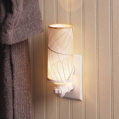 Crafted by the artisans of Eangee Home Design, the Cylinder Nightlight in natural against a clean backdrop, featuring handcrafted detailing, fair trade, eco friendly.