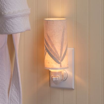 Crafted by the artisans of Eangee Home Design, the Paper Nightlight Bamboo in natural against a clean backdrop, featuring recycled paper shade, sustainably sourced, handcrafted, recycled materials.