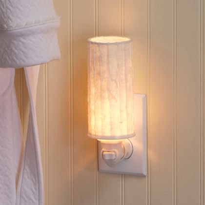 Crafted by the artisans of Eangee Home Design, the Paper Nightlight Lines in natural against a clean backdrop, featuring recycled paper shade, sustainably sourced, handcrafted, recycled materials.