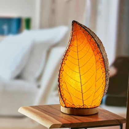 Leaf?shaped Leaflet table lamp crafted by Eangee Home Design with orange fossilized cocoa leaves stitched by hand to wrought iron; budding?leaf form breathes life as glowing light radiates through every vein; sustainably handcrafted by skilled artisans
