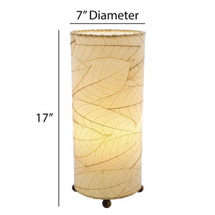 Crafted by the artisans of Eangee Home Design, the Cocoa Leaf Cylinder Table Lamp in natural against a clean backdrop, featuring fossilized cocoa leaf shade, wrought iron frame, handcrafted.