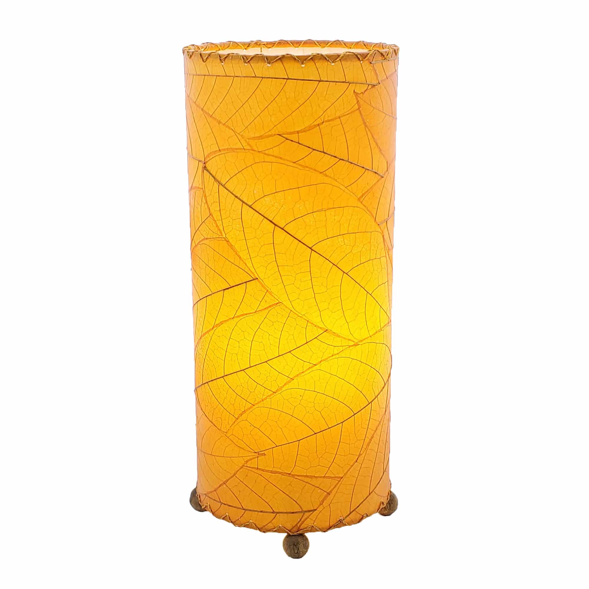 Crafted by the artisans of Eangee Home Design, the Cocoa Leaf Cylinder Table Lamp in orange against a clean backdrop, featuring fossilized cocoa leaf shade, wrought iron frame, handcrafted.