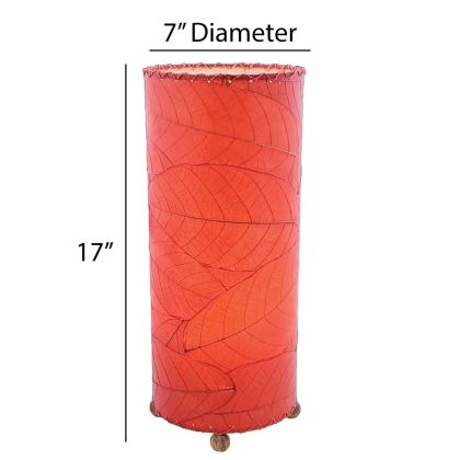 Crafted by the artisans of Eangee Home Design, the Cocoa Leaf Cylinder Table Lamp in red against a clean backdrop, featuring fossilized cocoa leaf shade, wrought iron frame, handcrafted.