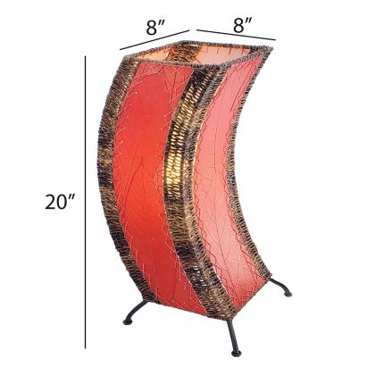 Crafted by the artisans of Eangee Home Design, the C Shape Table Lamp in red against a clean backdrop, featuring fossilized cocoa leaf shade, abaca rope accents, fair trade, handcrafted.