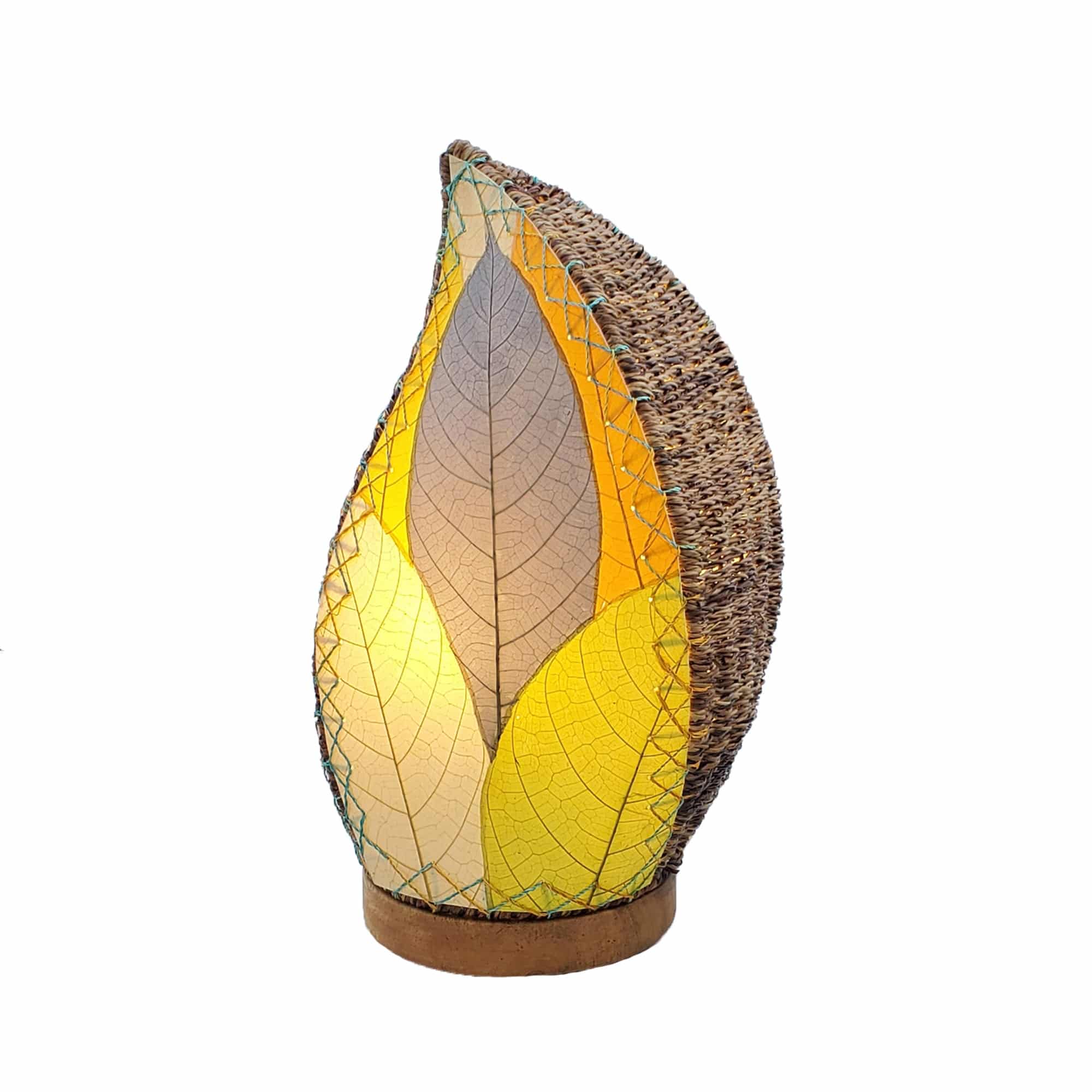Crafted by the artisans of Eangee Home Design, the Leaflet Table Lamp in multi color against a clean backdrop, featuring fossilized cocoa leaf shade, abaca rope accents, reclaimed mango wood base, wrought iron frame, sustainably sourced.