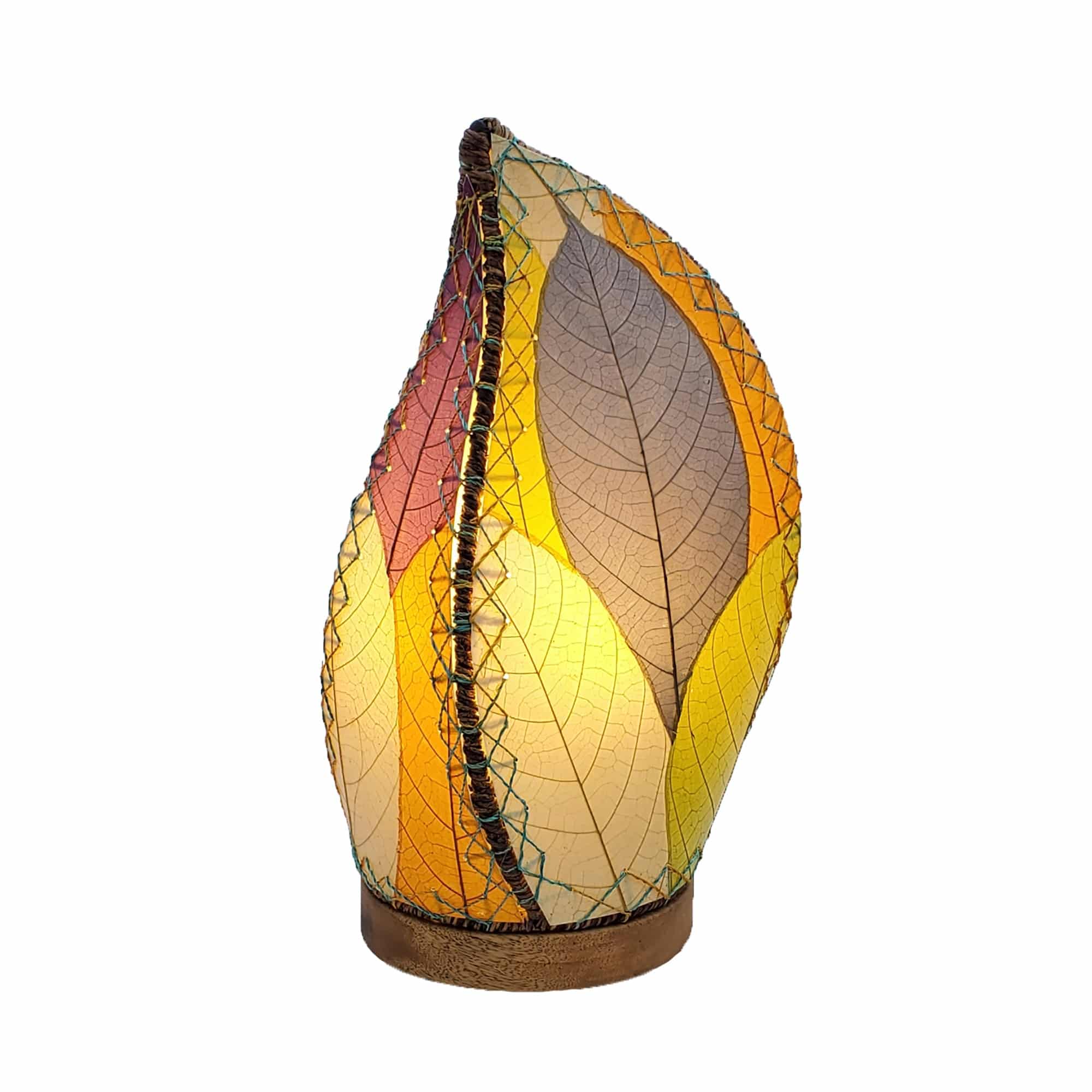 Crafted by the artisans of Eangee Home Design, the Leaflet Table Lamp in multi color against a clean backdrop, featuring fossilized cocoa leaf shade, abaca rope accents, reclaimed mango wood base, wrought iron frame, sustainably sourced.