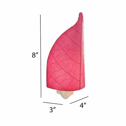The Leaf Nightlight in pink finish by Eangee Home Design displayed against a white background highlights its fossilized cocoa leaf panels and hand placed natural leaves, designed to the leaf nightlight is a little spark with a lot of soul.