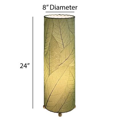 Crafted by the artisans of Eangee Home Design, the 24 Inch Cocoa Leaf Cylinder Table Lamp in green against a clean backdrop, featuring fossilized cocoa leaf shade, fair trade, eco friendly, sustainably sourced, handcrafted.