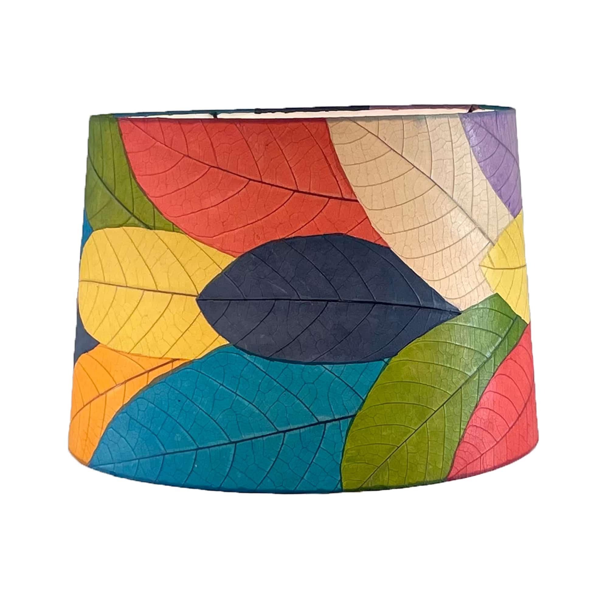 Crafted by the artisans of Eangee Home Design, the 16 Inch Tapered Drum Shade in multi color against a clean backdrop, featuring fossilized cocoa leaf shade, wrought iron frame, fair trade, sustainably sourced, handcrafted.