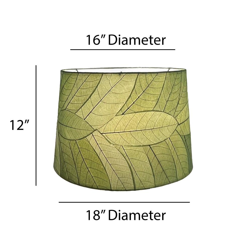 Crafted by the artisans of Eangee Home Design, the 18 Inch Tapered Drum Shade in green against a clean backdrop, featuring fossilized cocoa leaf shade, wrought iron frame, eco friendly, sustainably sourced.