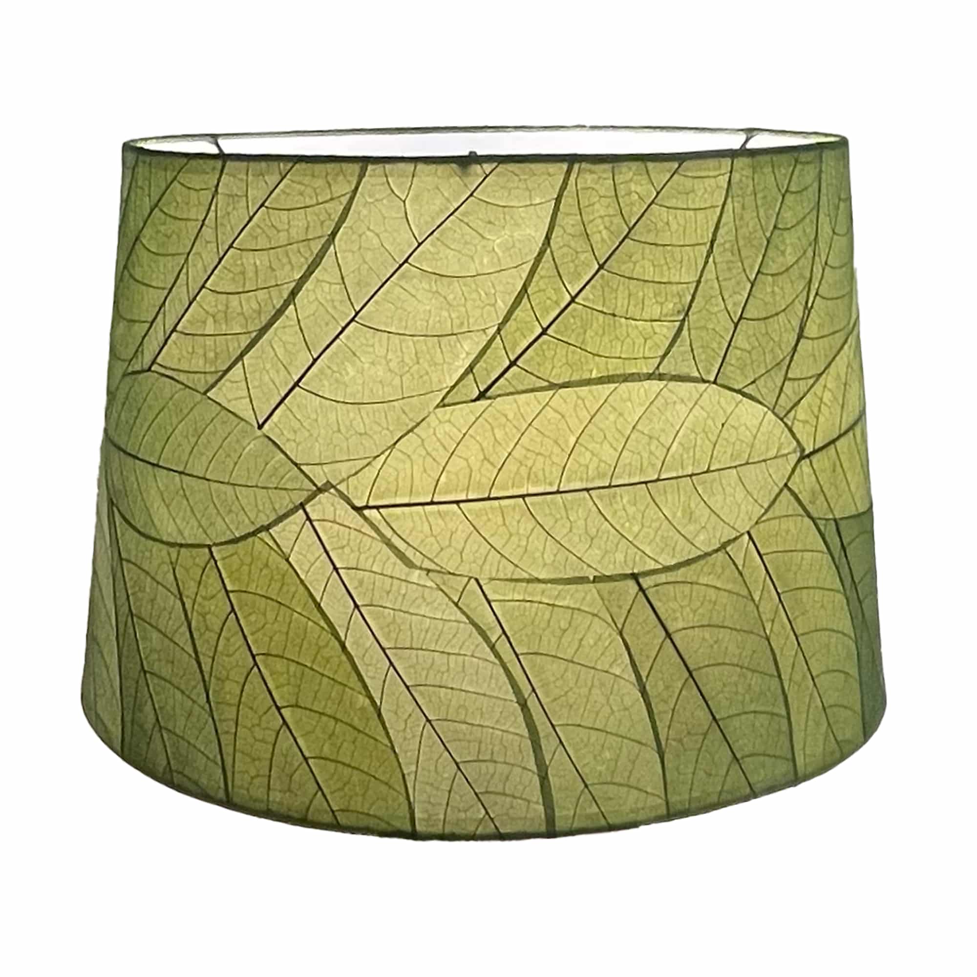 Crafted by the artisans of Eangee Home Design, the 18 Inch Tapered Drum Shade in green against a clean backdrop, featuring fossilized cocoa leaf shade, wrought iron frame, eco friendly, sustainably sourced.