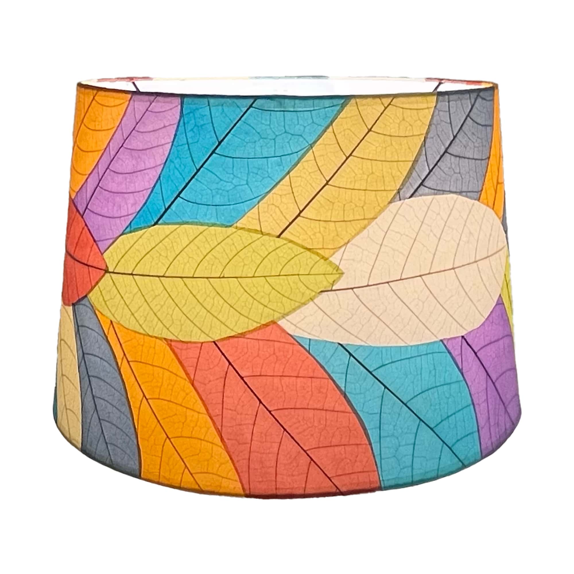 Crafted by the artisans of Eangee Home Design, the 18 Inch Tapered Drum Shade in multi color against a clean backdrop, featuring fossilized cocoa leaf shade, wrought iron frame, eco friendly, sustainably sourced.