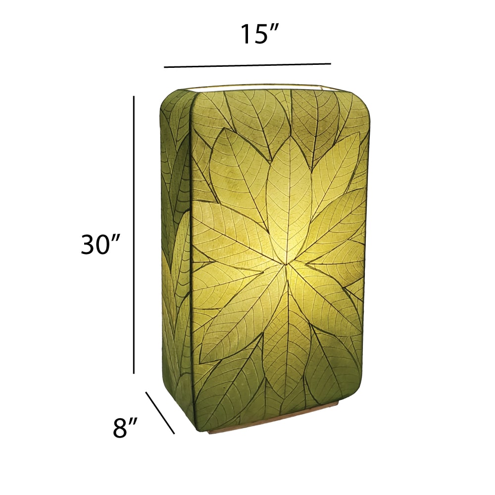 Crafted by the artisans of Eangee Home Design, the Sunburst Giant Floor Lamp in green against a clean backdrop, featuring fossilized cocoa leaf shade, fair trade, handcrafted.