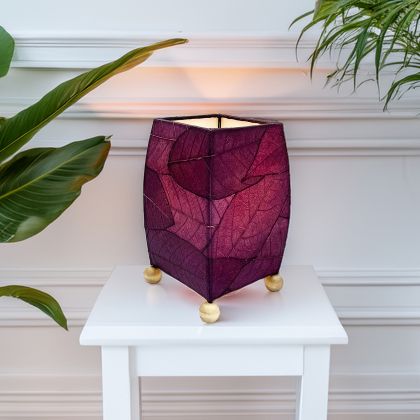Crafted by the artisans of Eangee Home Design, the Mini Square Cocoa Leaf Table Lamp in purple against a clean backdrop, featuring fossilized cocoa leaf shade, wrought iron frame, fair trade, eco friendly, sustainably sourced, handcrafted.
