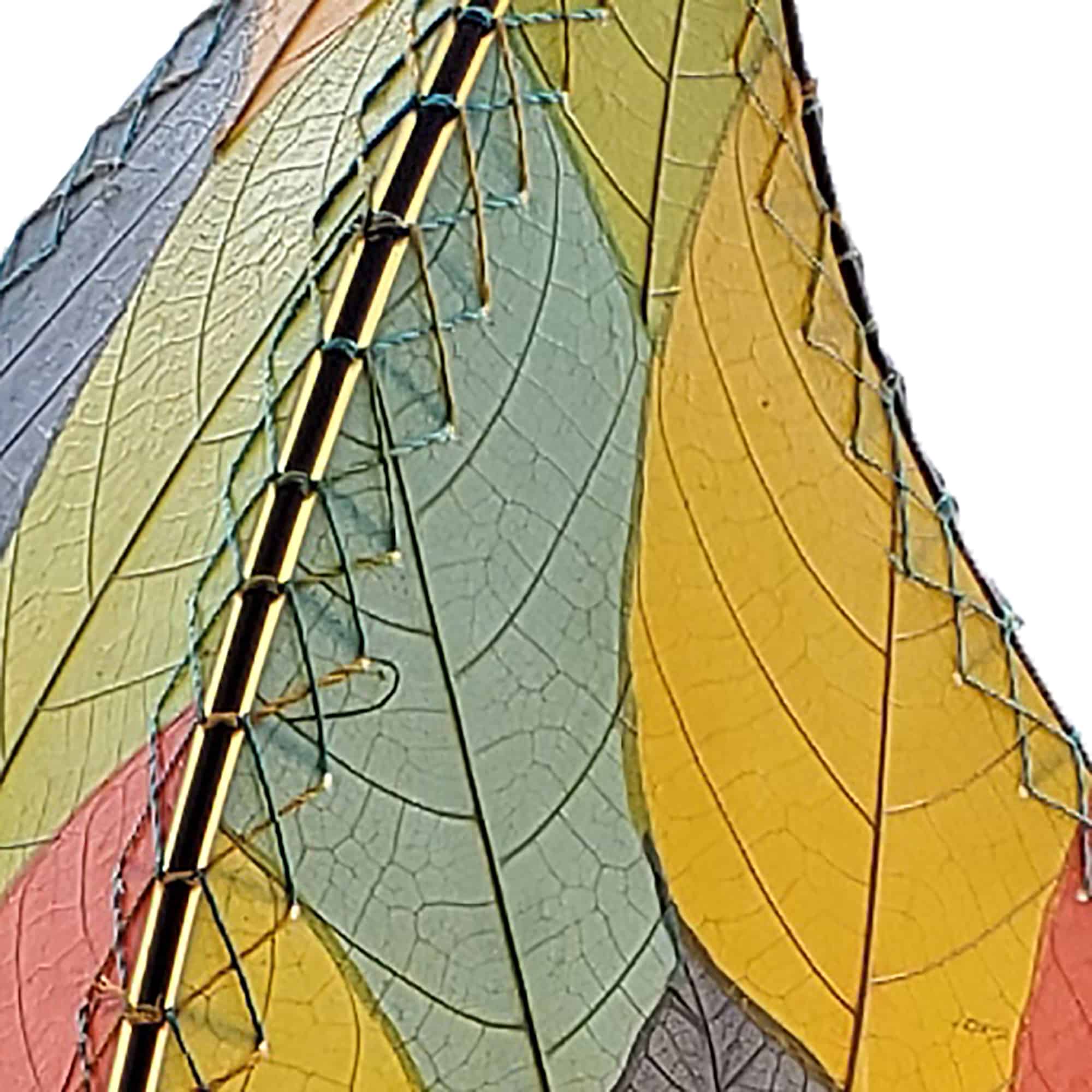 In a sun drenched entryway, crafted by the artisans of Eangee Home Design, the 24 Inch Leaflet Lamp in multi color stands gracefully, featuring fossilized cocoa leaf shade, abaca rope accents, wrought iron frame, handcrafted, adding warmth and character to the space.