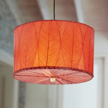 Crafted by the artisans of Eangee Home Design, the Drum Pendant 18 Inch in red against a clean backdrop, featuring fossilized cocoa leaf shade.