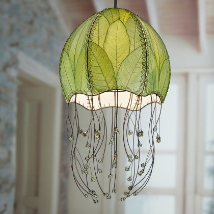 Crafted by the artisans of Eangee Home Design, the Jellyfish Pendant in green against a clean backdrop, featuring fossilized cocoa leaf shade, wrought iron frame, handcrafted.