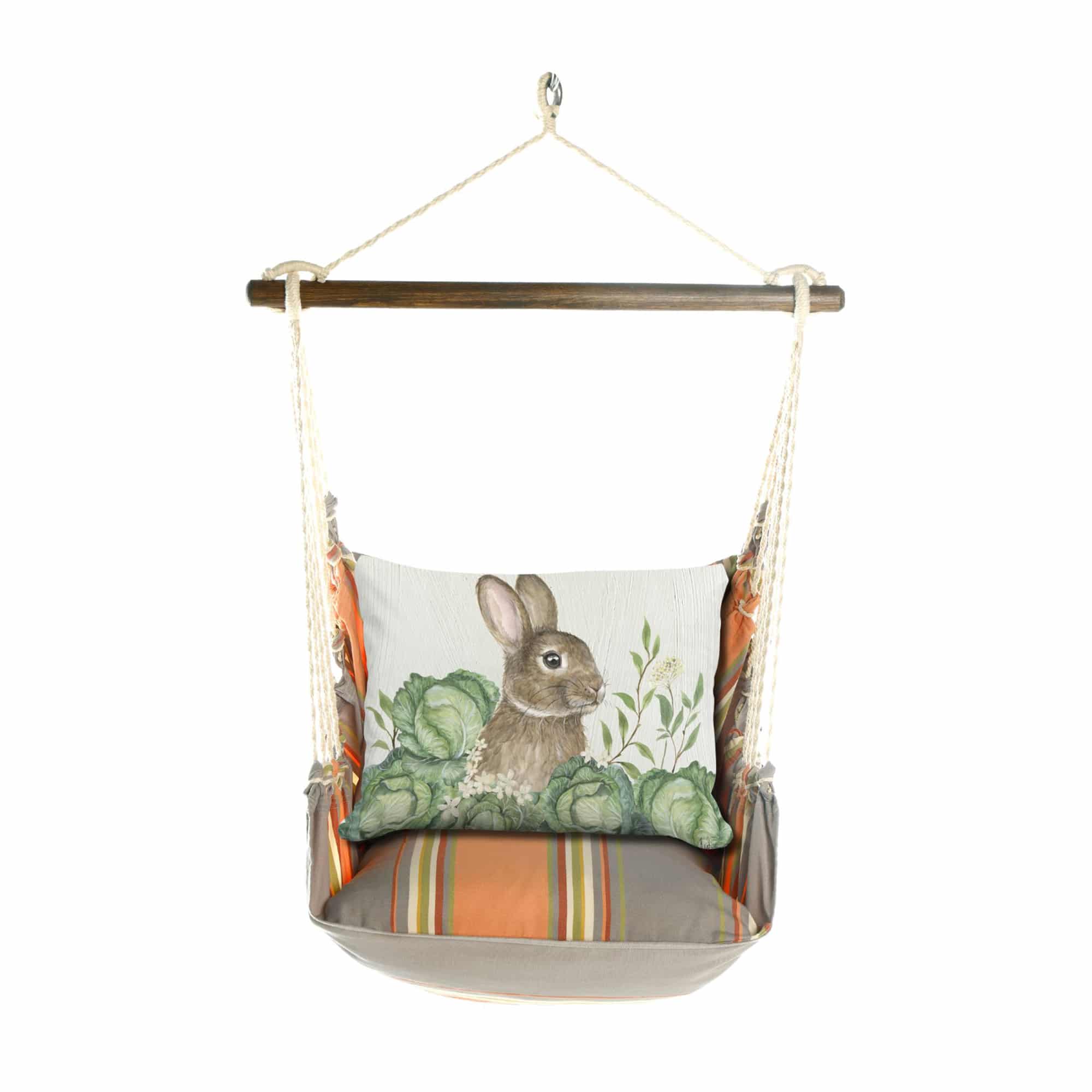 Multi colored outdoor swing crafted by the artisans of Magnolia Casual called the Swing Set 4 piece Serene Sunset w/ Rabbit and Cabbages featuring 100 percent weather resistant fabric, weather resistant polyester fabric, handcrafted shown against a clean backdrop featuring with a rabbit motif.