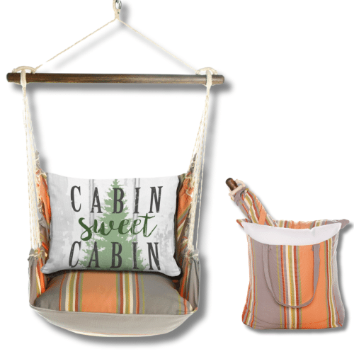 Multi colored outdoor swing crafted by the artisans of Magnolia Casual called the Swing Set 4 piece Serene Sunset w/ Cabin Sweet Cabin featuring 100 percent weather resistant fabric, weather resistant polyester fabric, handcrafted shown against a clean backdrop.