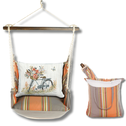 Multi colored outdoor swing crafted by the artisans of Magnolia Casual called the Swing Set 4 piece Serene Sunset w/ Bike with Flower Basket featuring 100 percent weather resistant fabric, weather resistant polyester fabric, handcrafted shown against a clean backdrop featuring with a floral motif.