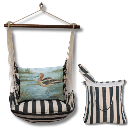 Black outdoor swing crafted by the artisans of Magnolia Casual called the Swing Set 4 piece True Black Stripe w/ Avocet Bird in Water featuring 100 percent weather resistant fabric, weather resistant polyester fabric, handcrafted shown against a clean backdrop featuring with a stripe motif and shades of black.