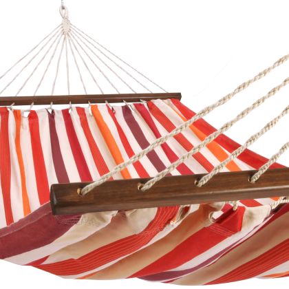 Multi colored outdoor textile crafted by the artisans of Magnolia Casual called the Hammock Cristina Stripe featuring 100 percent weather resistant fabric, weather resistant polyester fabric, sustainably sourced, artisan shown against a clean backdrop featuring with a stripe motif.