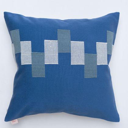 Blue pillow cover crafted by the artisans of Dos Tierras called the Ve Pillow Cover Blue featuring traditional backstrap loom weave, handwoven textile, handcrafted shown against a clean backdrop featuring shades of blue.
