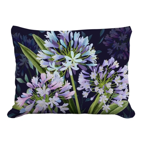 Multi colored outdoor pillow crafted by the artisans of Magnolia Casual called the Outdoor Pillow Midnight Garden Lilies 19x24 featuring handwoven textile shown against a clean backdrop.