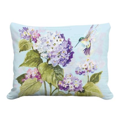 Multi colored outdoor pillow crafted by the artisans of Magnolia Casual called the Outdoor Pillow Hummingbird with Hydrangea 19x24 featuring handwoven textile shown against a clean backdrop featuring with a hummingbird motif.