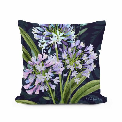 Multi colored outdoor pillow crafted by the artisans of Magnolia Casual called the Outdoor Pillow Midnight Garden Lilies 18x18 featuring handwoven textile shown against a clean backdrop.
