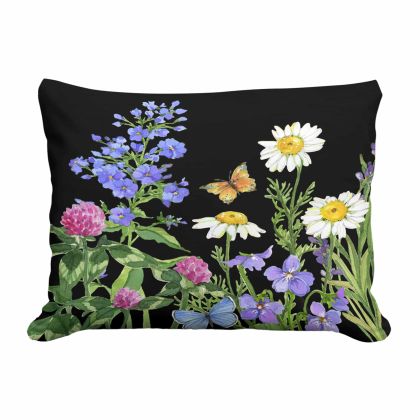 Multi colored outdoor pillow crafted by the artisans of Magnolia Casual called the Outdoor Pillow Garden Meadow 2 13x18 featuring handwoven textile shown against a clean backdrop.