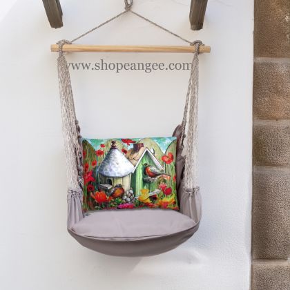 In a shaded porch swing a gray outdoor swing crafted by the artisans of Magnolia Casual called the Swing Set 4 piece Gray Solid w/ Birdhouse w/Dome is displayed featuring 100 percent weather resistant fabric, weather resistant polyester fabric, handcrafted adding comfort and style to the space featuring shades of gray.