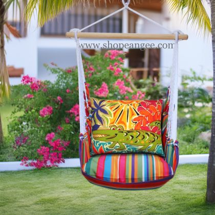In a cozy garden seating area a multi colored outdoor swing crafted by the artisans of Magnolia Casual called the Swing Set 4 piece Le Jardin Stripe w/ Alligator is displayed featuring 100 percent weather resistant fabric, weather resistant polyester fabric, handcrafted adding comfort and style to the space featuring with a stripe motif.