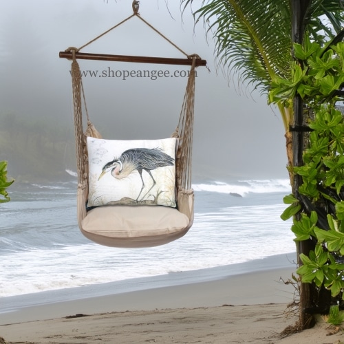 In a sunlit patio lounge a multi colored outdoor swing crafted by the artisans of Magnolia Casual called the Swing Set 4 piece Latte Solid w/ Heron on Limb is displayed featuring 100 percent weather resistant fabric, weather resistant polyester fabric, handcrafted adding comfort and style to the space.