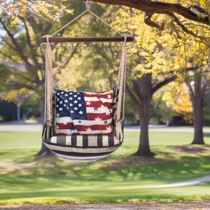 In a sunlit patio lounge a multi colored outdoor swing crafted by the artisans of Magnolia Casual called the Swing Set 4 piece Marina Stripe w/ American Flag with Stars is displayed featuring 100 percent weather resistant fabric, weather resistant polyester fabric, handcrafted adding comfort and style to the space featuring with a stripe motif.
