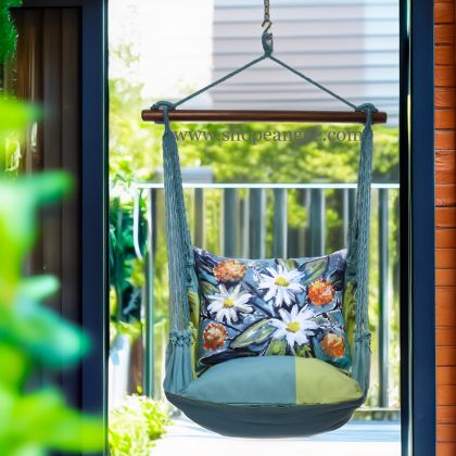 In a sunlit patio lounge a multi colored outdoor swing crafted by the artisans of Magnolia Casual called the Swing Set 4 piece Meadow Mist Stripe w/ Floral Impressions is displayed featuring 100 percent weather resistant fabric, weather resistant polyester fabric, handcrafted, natural materials adding comfort and style to the space featuring with a stripe motif.