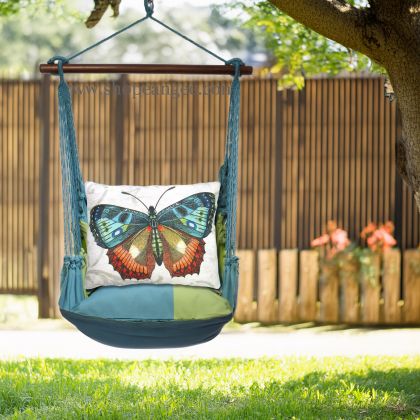 In a poolside chaise a multi colored outdoor swing crafted by the artisans of Magnolia Casual called the Swing Set 4 piece Meadow Mist Stripe w/ Butterfly M2 is displayed featuring 100 percent weather resistant fabric, weather resistant polyester fabric, handcrafted, natural materials adding comfort and style to the space featuring with a stripe motif.